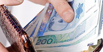 Norwegian metal and paper money in the opened purse of silver skin Norwegian metal and paper money in the opened purse of silver skin