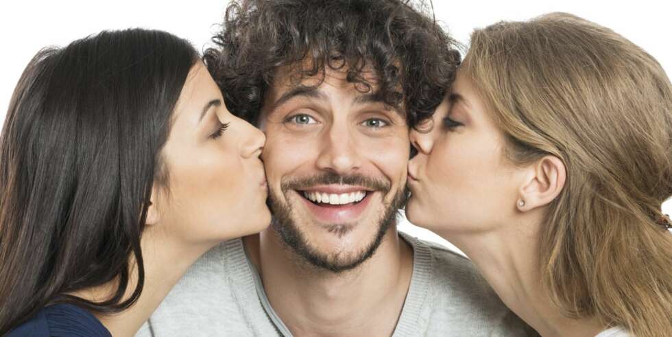 Women Kissing Man On Cheeks Women Kissing Man On Cheeks