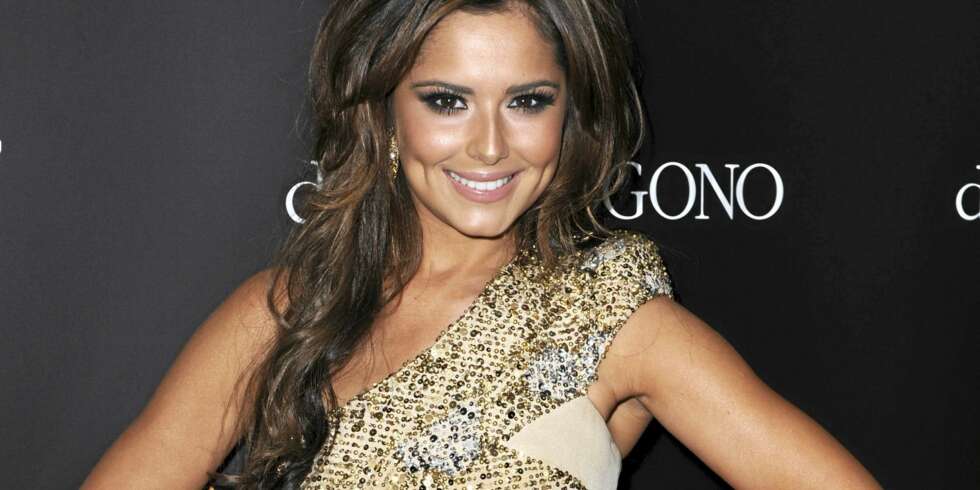 FÅR ERSTATNING: Cheryl Cole kan le hele veien til banken. FÅR ERSTATNING: Cheryl Cole kan le hele veien til banken.