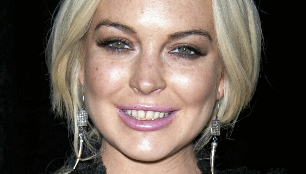SMILER IGJEN: Lindsay Lohan fikk tilbake vesken sin, og tok det med fatning at kontantene var vekk som svisker. SMILER IGJEN: Lindsay Lohan fikk tilbake vesken sin, og tok det med fatning at kontantene var vekk som svisker.
