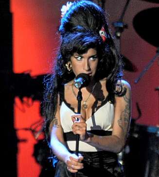 OVERRASKET: Amy Winehouse sang klokkerent under Nelson Mandelas bursdagsfeiring til tross for sin skrantende helse de siste ukene. OVERRASKET: Amy Winehouse sang klokkerent under Nelson Mandelas bursdagsfeiring til tross for sin skrantende helse de siste ukene.