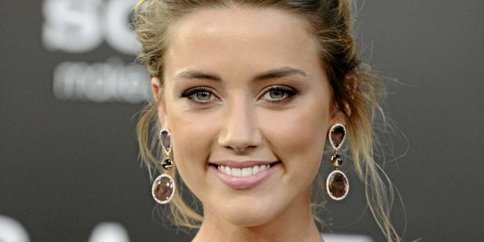UTE AV SKAPET: Amber Heard gikk fredag offisielt ut med at hun er homofil. UTE AV SKAPET: Amber Heard gikk fredag offisielt ut med at hun er homofil.