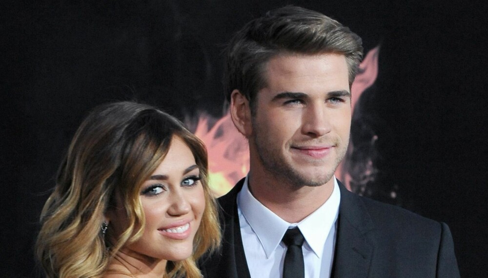 FORLOVET:?: Passet Liam Hemsworth på å fri til Miley Cyrus i kinomørket under premieren på"«Hunger Games»?