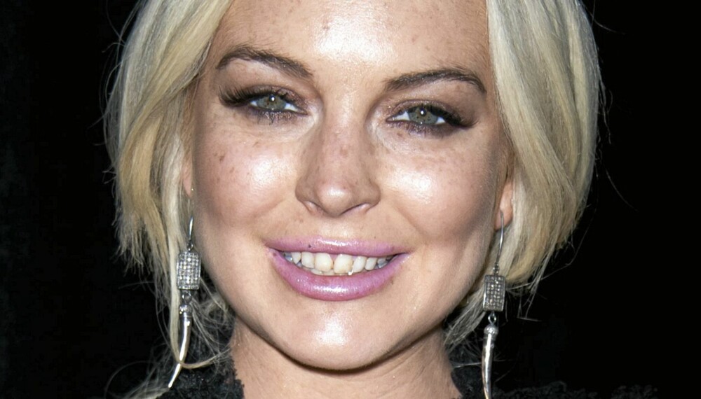 SMILER IGJEN: Lindsay Lohan fikk tilbake vesken sin, og tok det med fatning at kontantene var vekk som svisker.