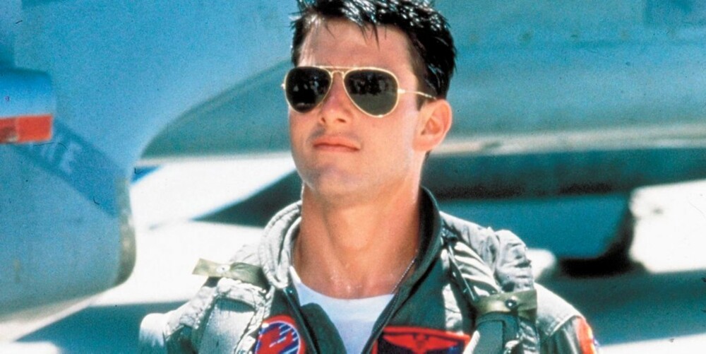 BARSK PILOT: Tom Cruise smeltet mange pikehjerter på 80-tallet. Her som Maverick i "Top Gun - i uniform og med pilotbriller.