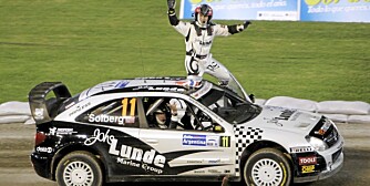 Petter Solberg of Norway, top, and his co-driver Philip Mills wave to fans from their Citroen Xsara after the first special of the WRC Argentina Rally at Cordoba Stadium in Cordoba, Argentina, Thursday, April 23, 2009. (AP Photo/Eduardo Di Baia)