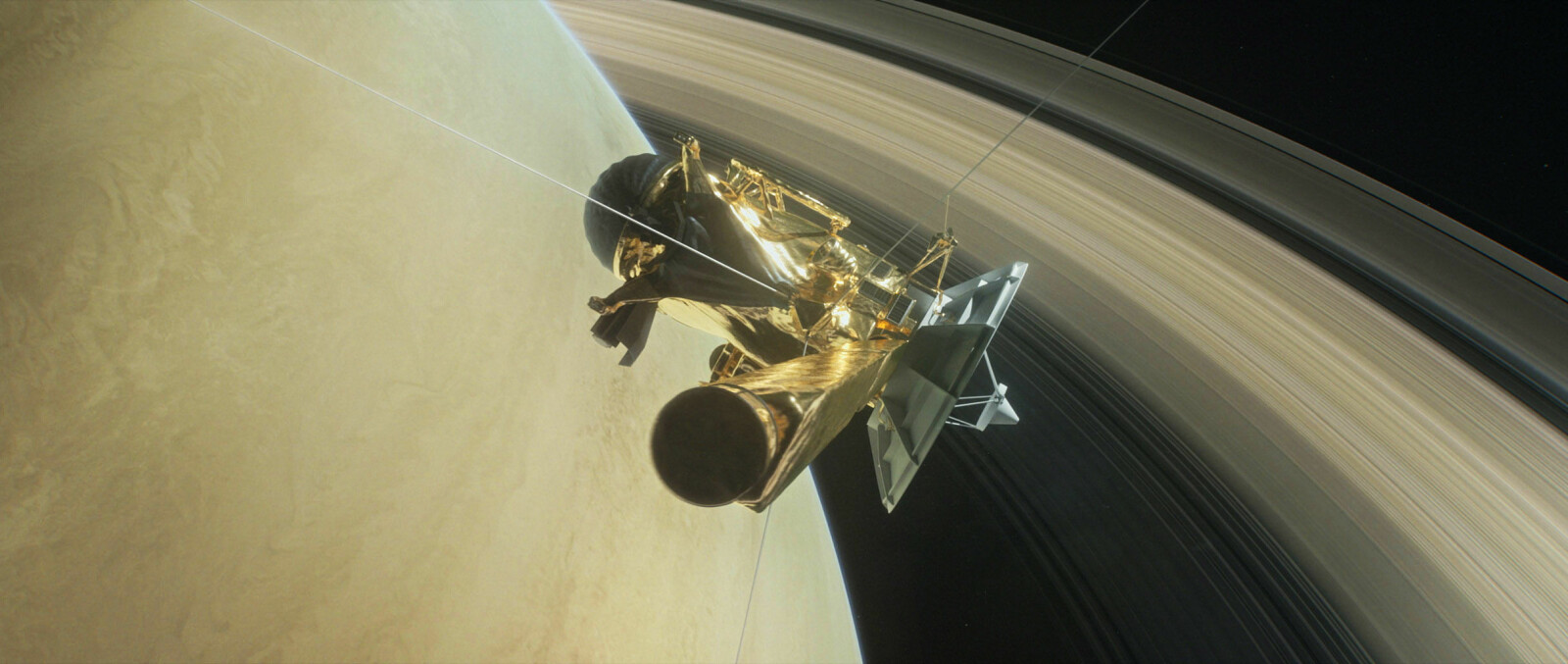 Illustrasjon av Cassini i det den dukker ned mellom Saturn og dens innerste ringer. Dette ble romsondens "Grand finale".