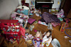 kids room in big disorder. two kids friends looking into the camera while there playroom is in total disorder and chaos