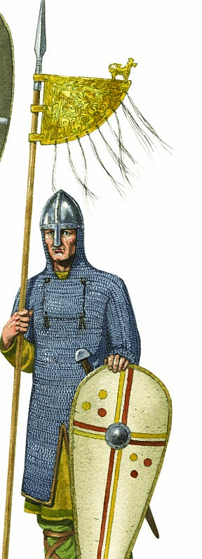Merkesmann, 1066: Brynjen dekker nå kroppen ned til knærne, og har et eget stykke som kan festes opp foran nedre del av ansiktet. Merket (banneret) i forgylt kobber er av karakteristisk
nordisk type.